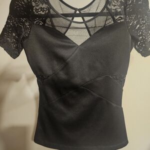 Guess top short sleeve ,lace, eyelet closure sheer in the back